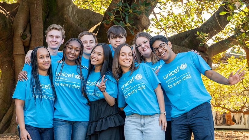 Photo of diverse group of young people in UNICEF Australia t shirts