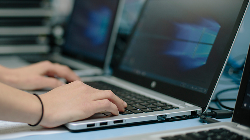 Image of child working on laptop